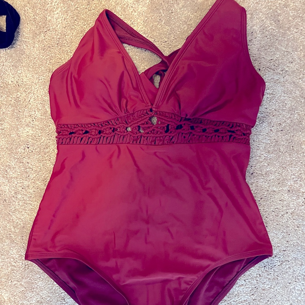 Gorgeous one piece swim suit with adjustable tie back and macrame mid-section!